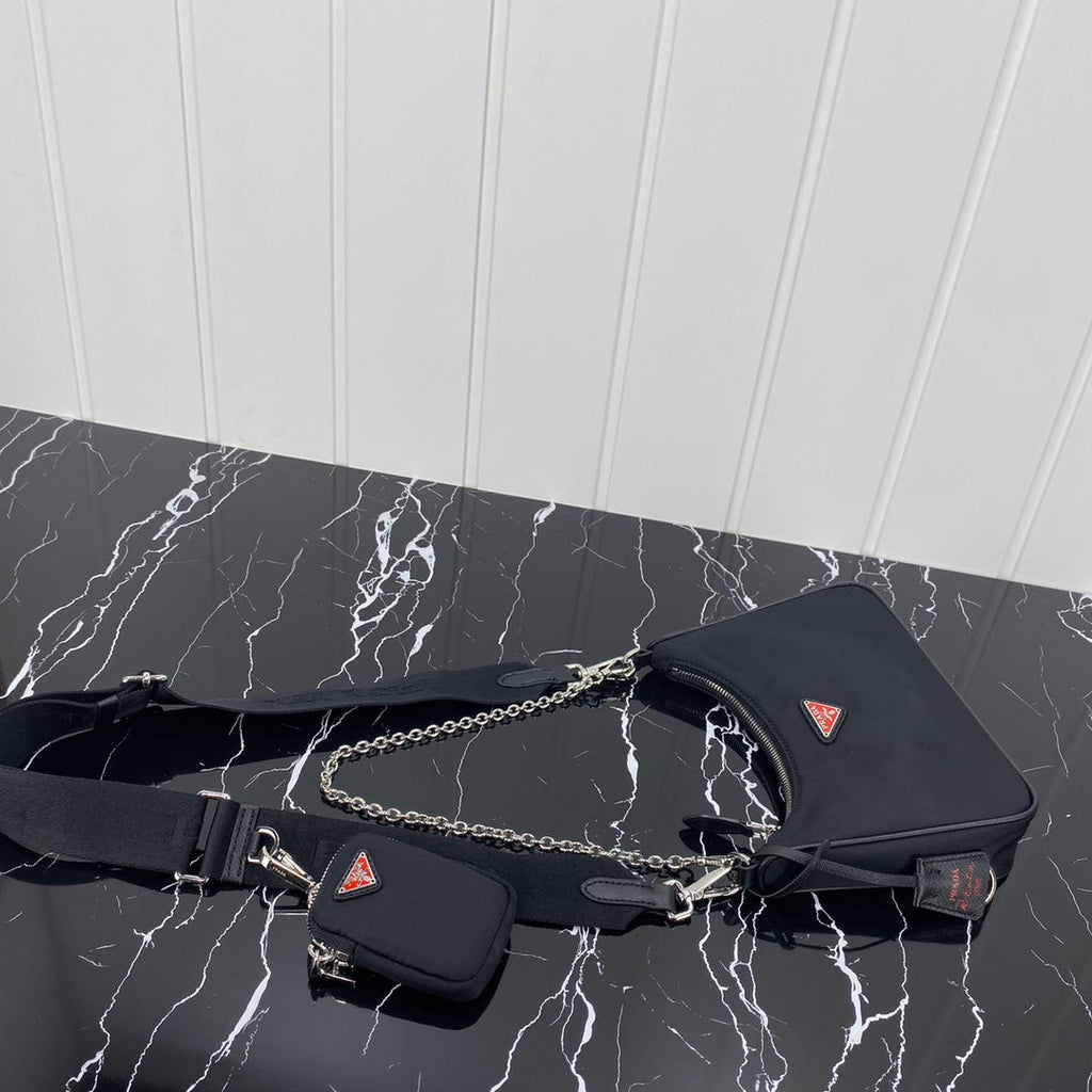 PRADA HOBO 22 BAG IN BLACK RE-NYLON WITH RED LOGO