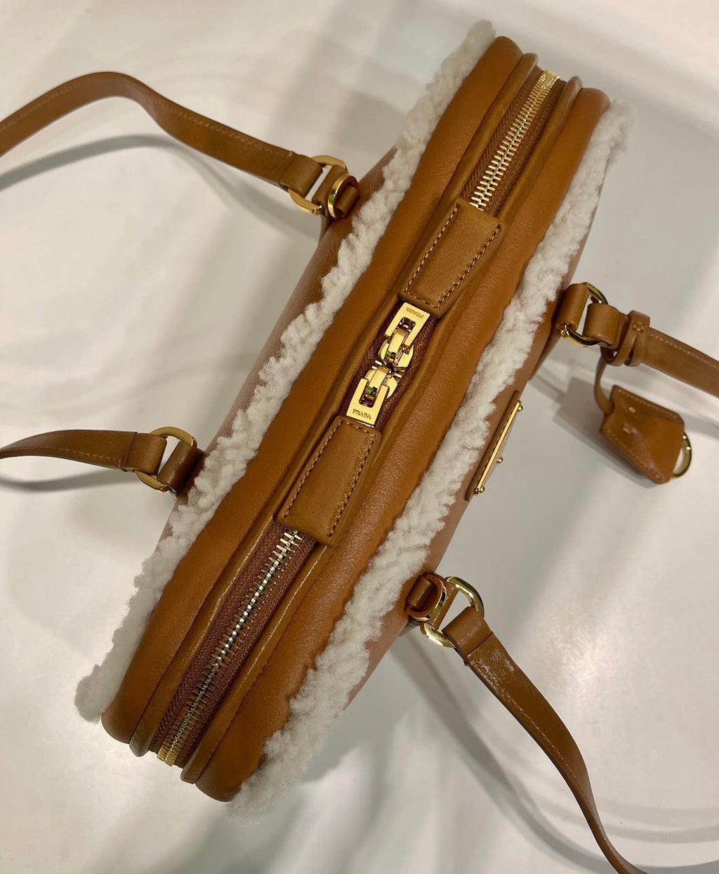 PRADA TOP HANDLE BAG 27 IN BRONZE BROWN SHEEPSKIN AND SHEARLING TRIM