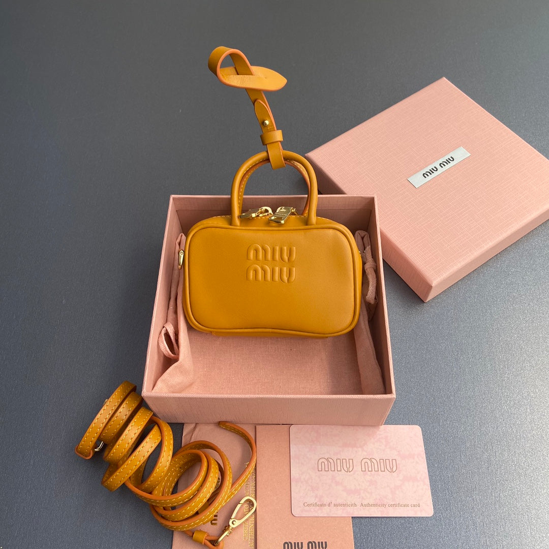 MICRO BAG KEYCHAIN 11 IN INDOCHINE ORANGE CALFSKIN EMBOSSED LOGO