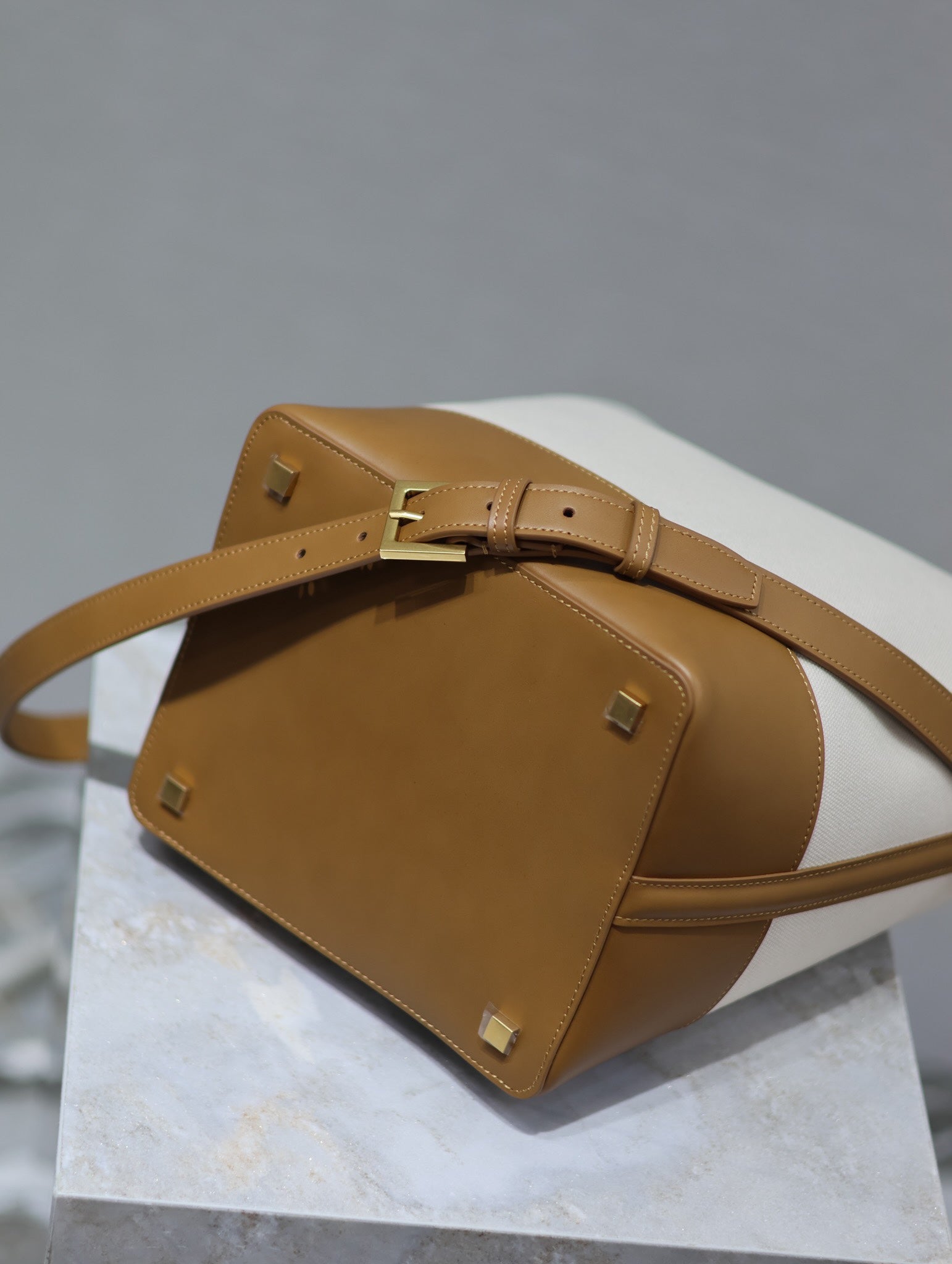 YSL 25S LE 5 À 7 BUCKET 26 IN CREAM BROWN CALFSKIN AND CANVAS GOLD HARDWARE