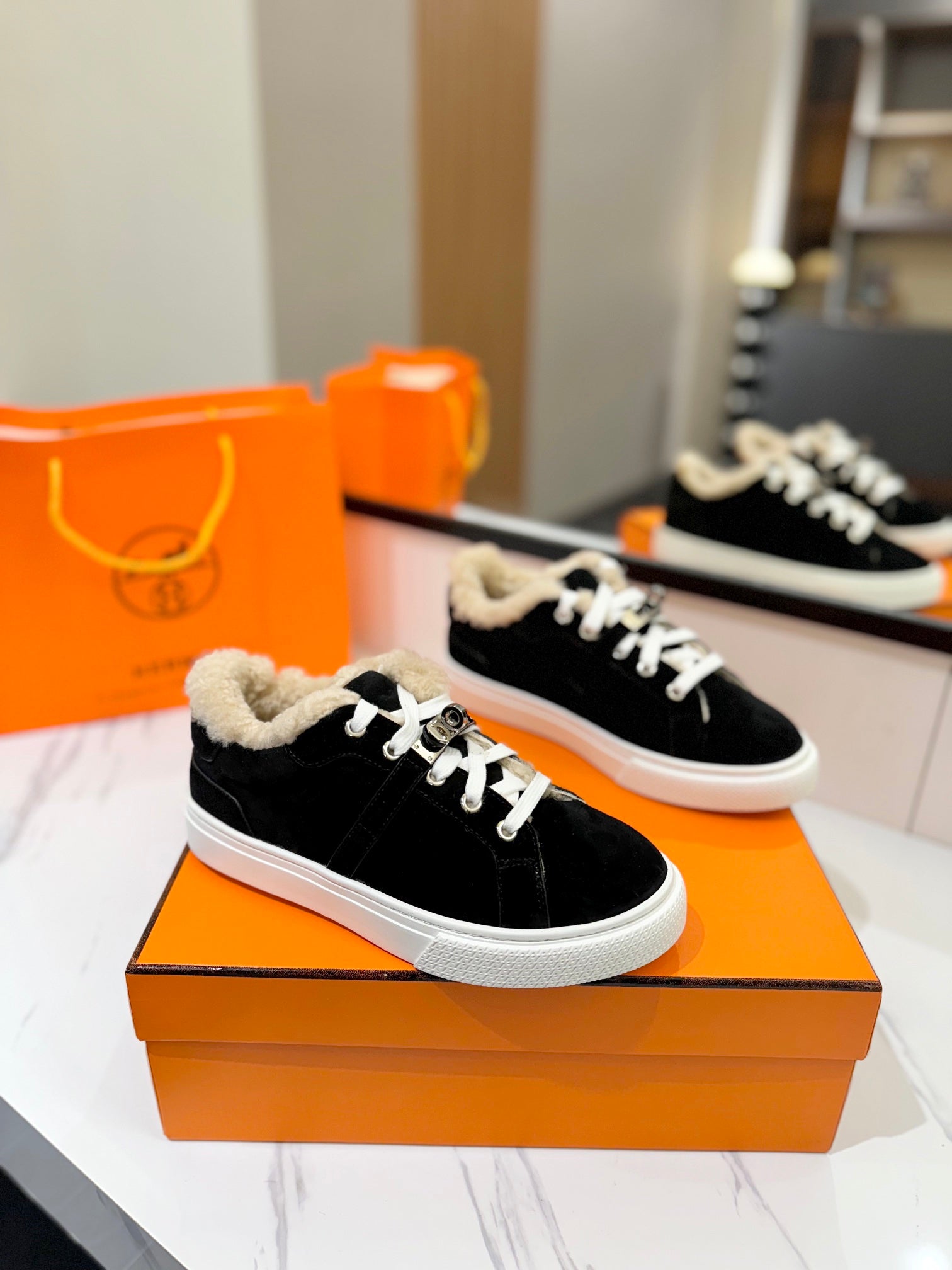 HERMES DAY SNEAKER IN BLACK SUEDE AND FLEECE LINING